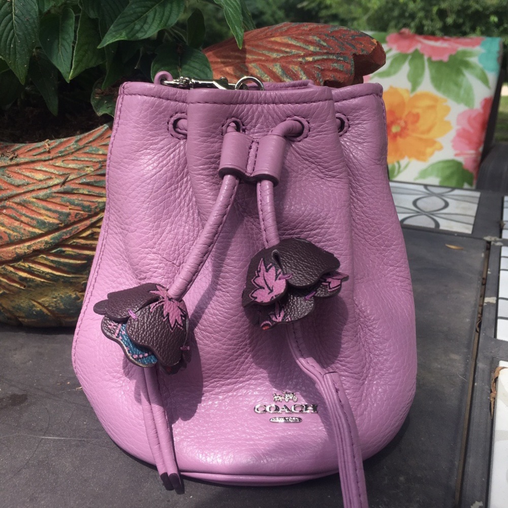 Coach lavender drawstring wristlet with flower detailing inside